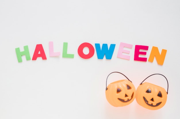 Jack-o-lantern baskets near Halloween writing