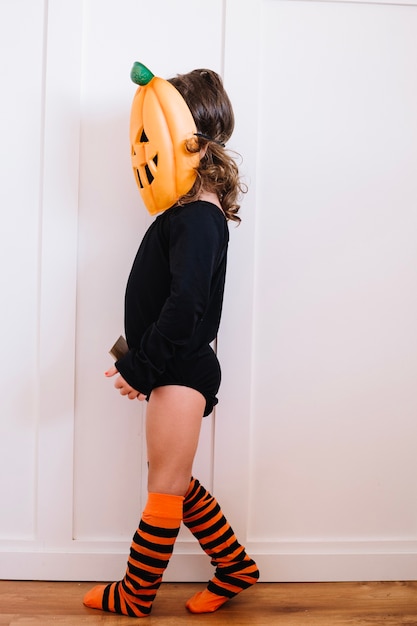 Free photo jack-o-lantern in striped long socks