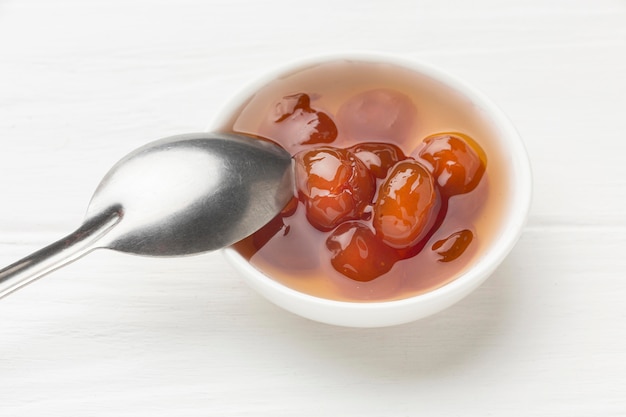 Jam in bowl with spoon