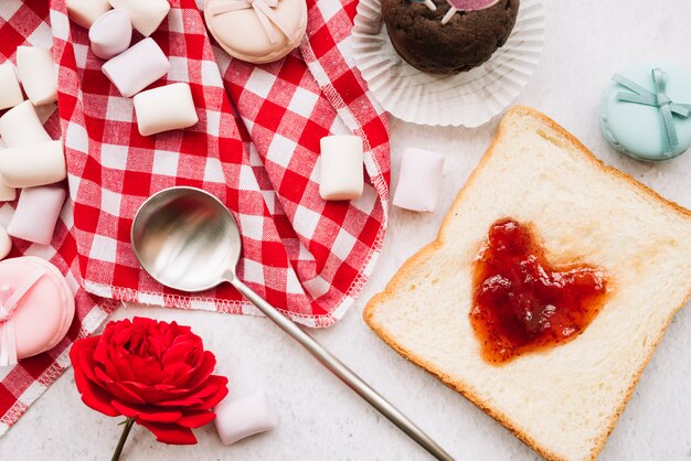 Jam in shape of heart on toast with marshmallows 