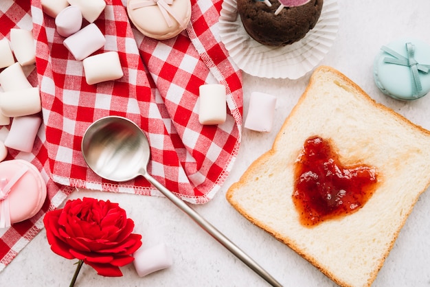 Jam in shape of heart on toast with marshmallows 