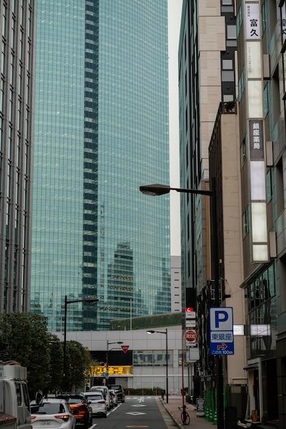 japan street with cars and skyscraper