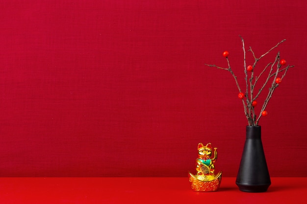 Japanese aesthetic with branches in vase and cat
