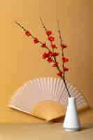 Free photo japanese aesthetic with branches in vase