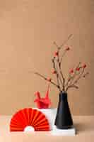 Free photo japanese aesthetic with branches in vase