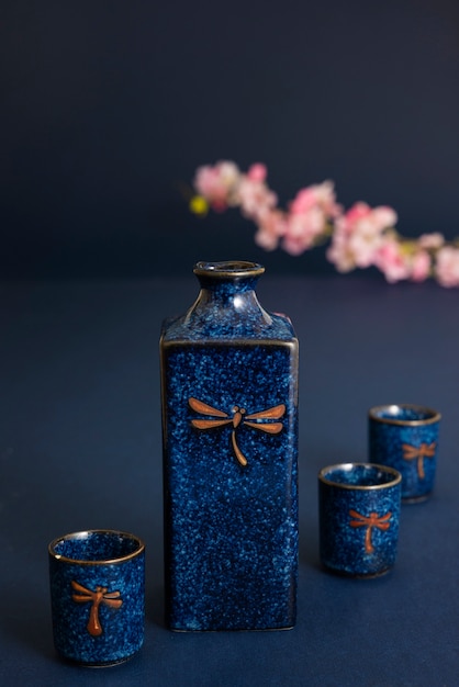 Japanese bottle and cups with pink flowers