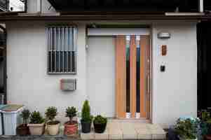 Free photo japanese culture house entrance and plants pots