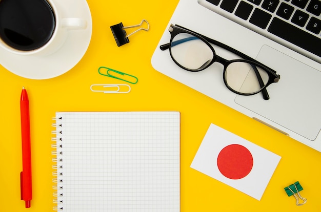 Japanese flag next to empty notebook