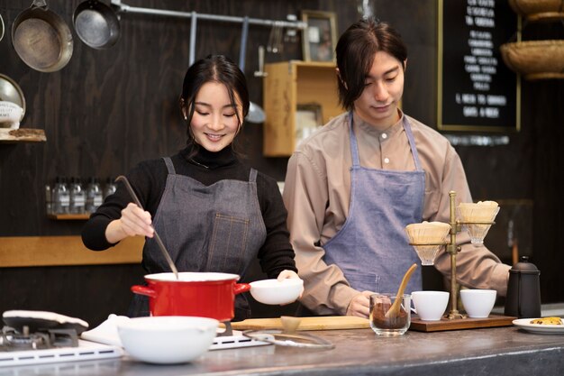 Japanese man and woman cooking in a restaurant