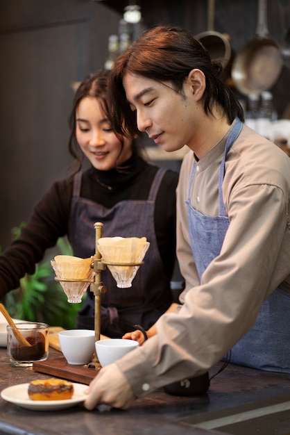 Japanese man and woman cooking in a restaurant