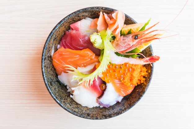 Japanese rice bowl with sashimi seafood on top