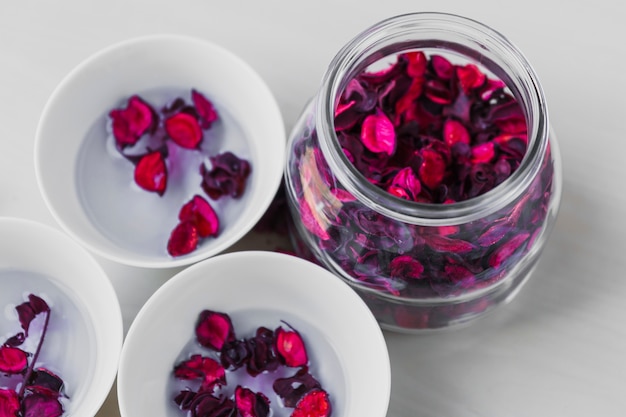 Free photo jar and bowls with petals