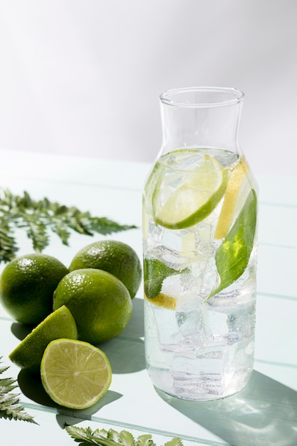 Jar with fresh lemon and lime on table