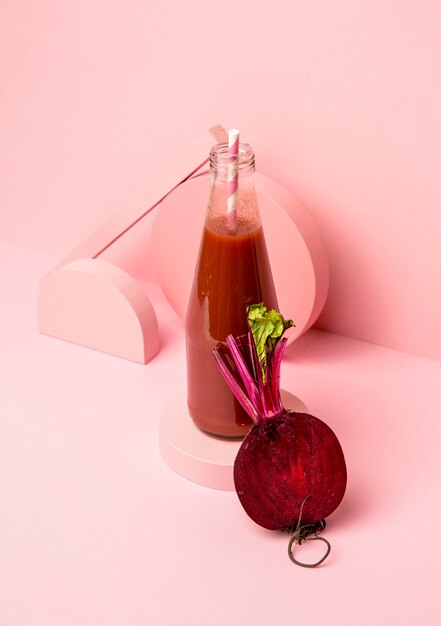 Jar with fresh smoothie of beetroot on desk