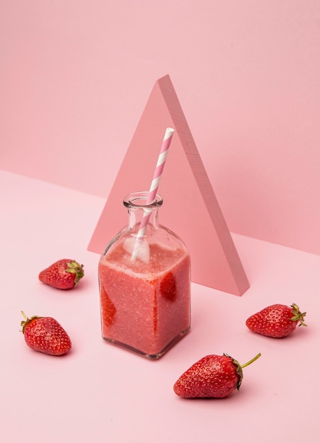 Jar with fresh smoothie of strawberry