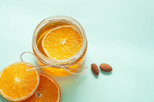 Jar with lemon slices and almonds