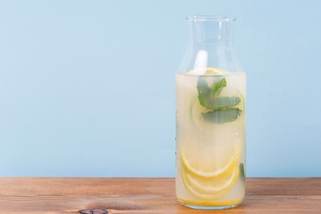 Jar with lemonade on table