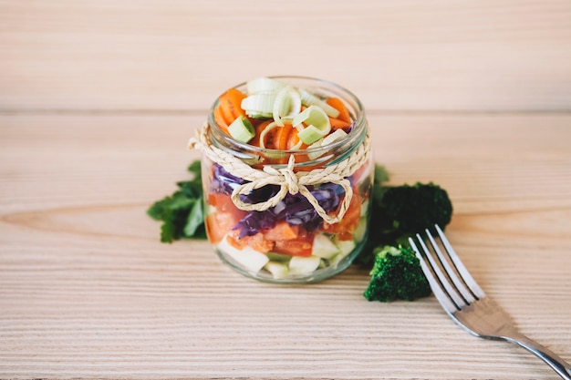 Jar with vegetable salad