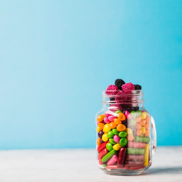 Jar with winegums and candy drops