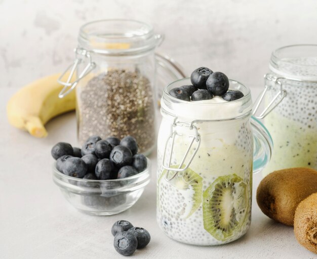 Jars filled with milk and fruit