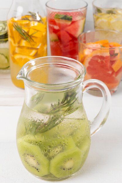 Jars with fruits flavor drinks on desk