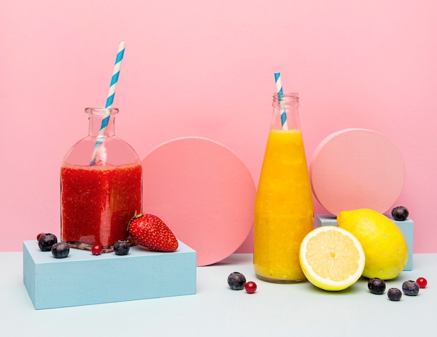 Jars with healthy smoothie on table