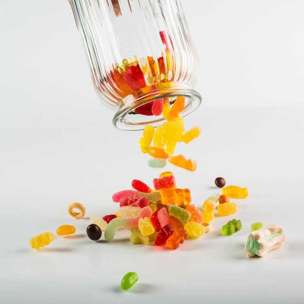 Jelly candies spilling from jar