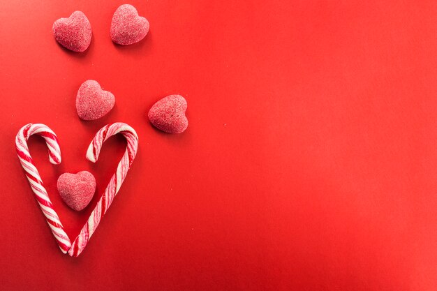 Jelly hearts near candy canes