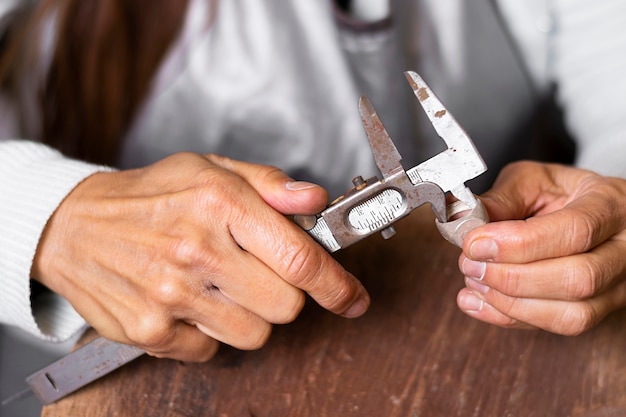 Jeweler hands using mechanical tools