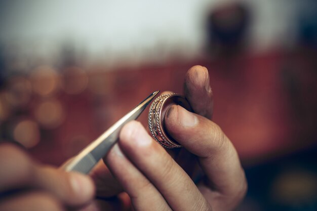 Jeweler at work in jewelry