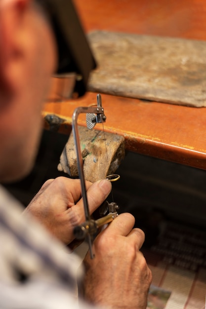 Jewelry maker working alone in the atelier