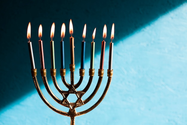 Jewish menorah with candles burning