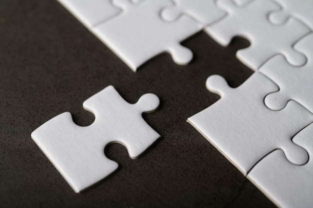 Jigsaw puzzle with missing piece. Missing puzzle pieces Stock Photo