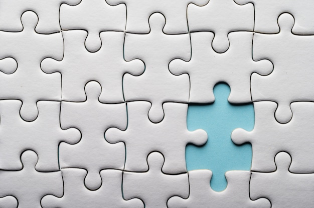 Jigsaw puzzle with missing piece. Missing puzzle pieces Stock Photo