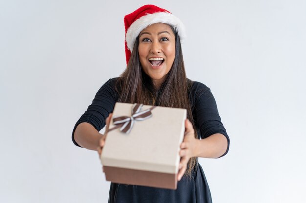 Jolly Christmas lady giving gift