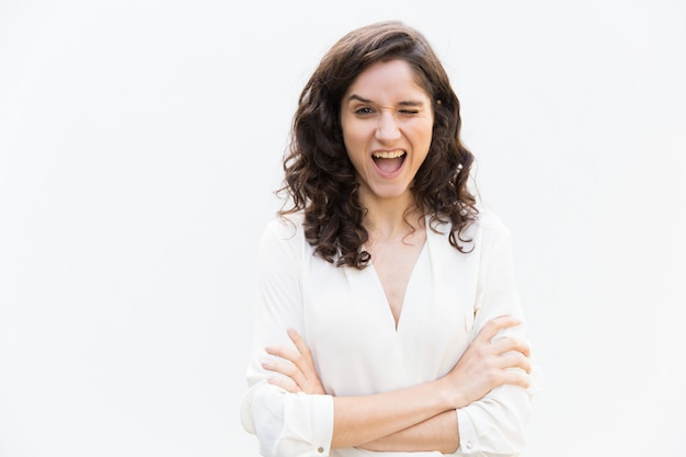 Free photo joyful amazed woman winking