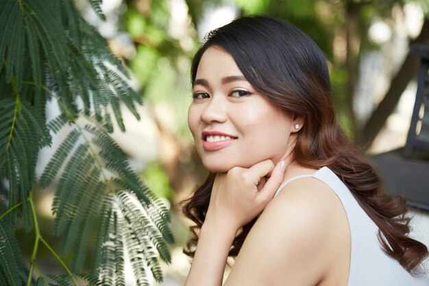 Joyful brunette in park