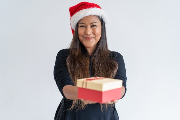 Joyful Christmas lady giving gifts