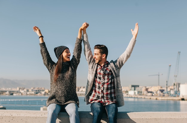 Joyful couple in harbor area