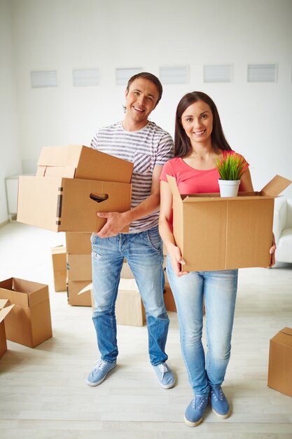 Joyful couple in their new apartment