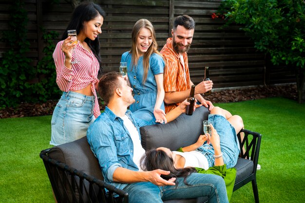 Joyful friends chilling together outdoos