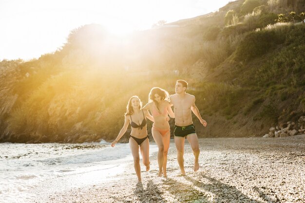 Joyful friends together at the beach