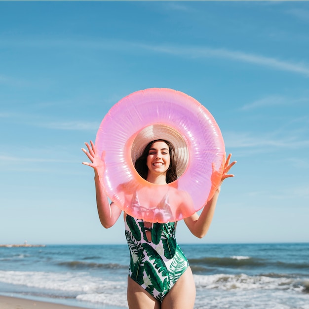Joyful girl with inflatable ring
