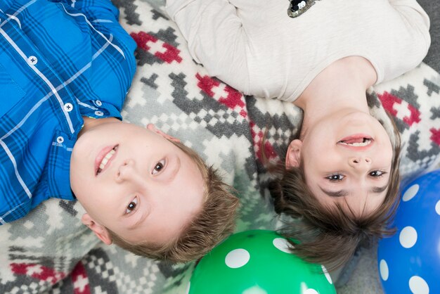 Joyful kids playing with balloons