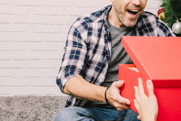 Free photo joyful man receiving present