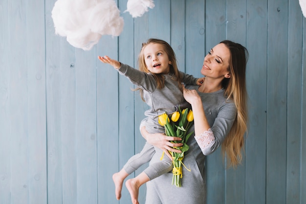 Joyful mother and daughter celebrating mothers day