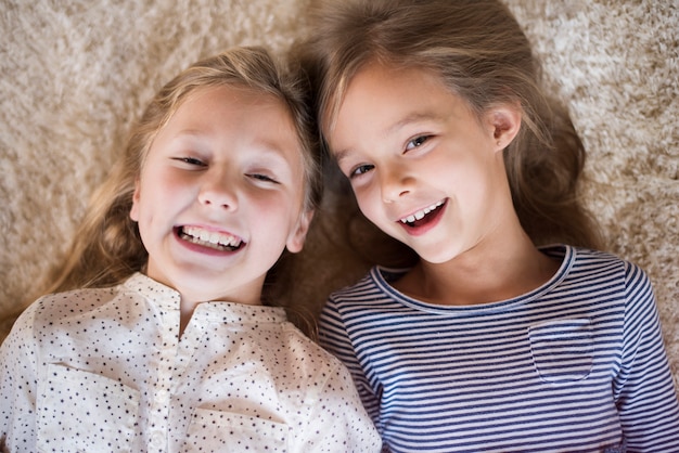 Joyful sisters having fun together