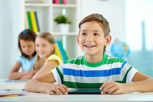 Joyful student with digital tablet