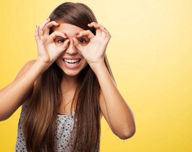 Joyful teen playing with her hands