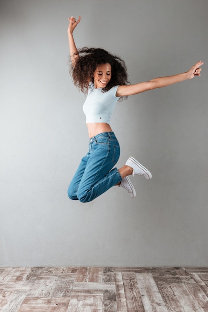 Joyful woman jumping
